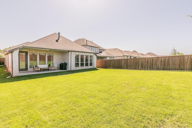 1704 Cypress Gap Trl, Mansfield, TX 76063 - rear view of house with a patio area, brick siding, and roof with shingles