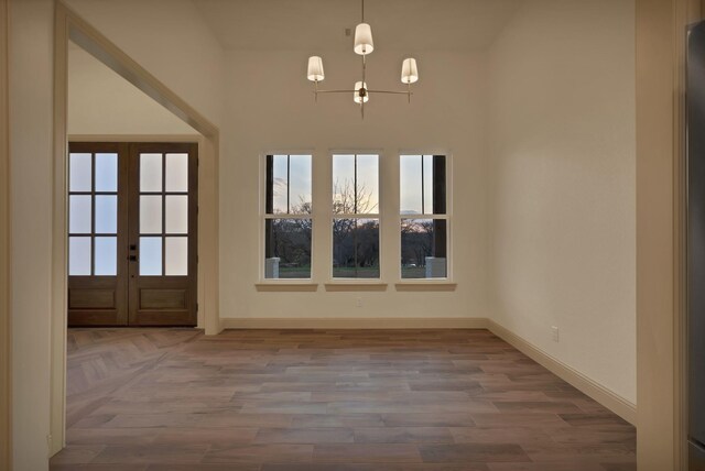 2113 Dicey Rd, Weatherford, TX 76085 - unfurnished dining area with baseboards, plenty of natural light, and french doors