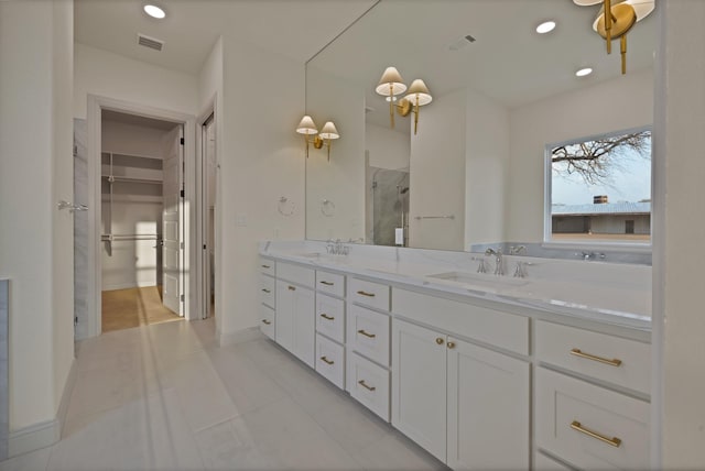 2113 Dicey Rd, Weatherford, TX 76085 - full bath with a stall shower, double vanity, tile patterned flooring, a spacious closet, and recessed lighting
