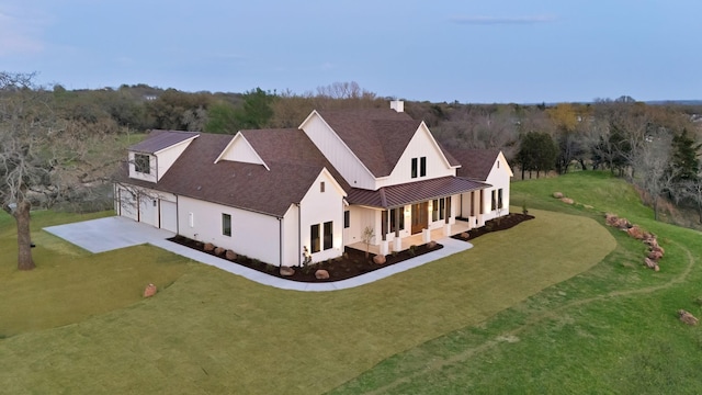 2113 Dicey Rd, Weatherford, TX 76085 - view of property exterior with a standing seam roof, a lawn, driveway, and a garage