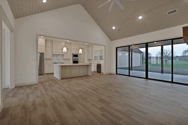 2113 Dicey Rd, Weatherford, TX 76085 - unfurnished living room featuring high vaulted ceiling, recessed lighting, baseboards, light wood-type flooring, and a ceiling fan
