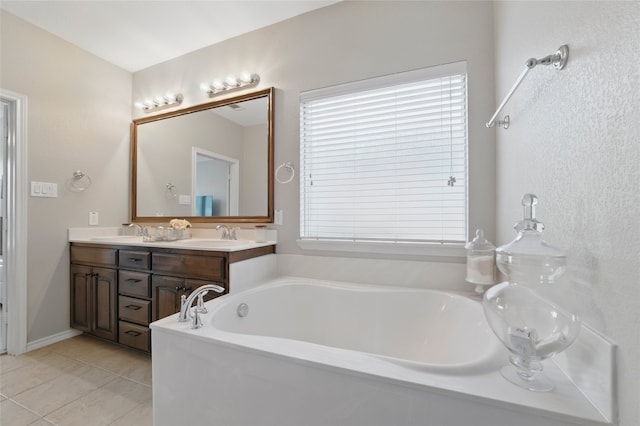 13165 Red Robin Dr, Fort Worth, TX 76244 - full bath featuring a garden tub, tile patterned flooring, and double vanity