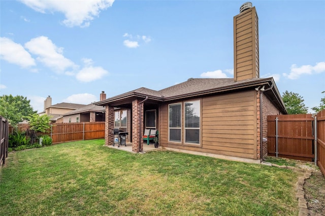 13165 Red Robin Dr, Fort Worth, TX 76244 - back of house with a chimney, a patio area, and brick siding