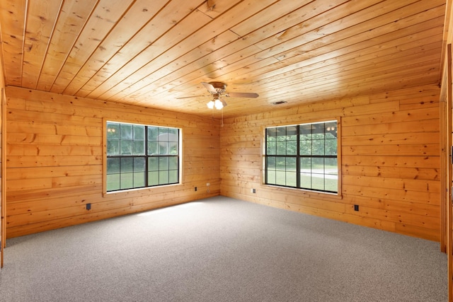 201 Cemetery Rd, Boyd, TX 76023 - spare room featuring wooden ceiling, carpet, wooden walls, and a ceiling fan