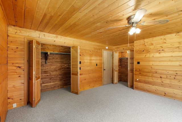 201 Cemetery Rd, Boyd, TX 76023 - unfurnished bedroom featuring carpet floors, wood walls, wooden ceiling, and a ceiling fan