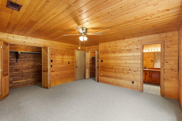 201 Cemetery Rd, Boyd, TX 76023 - unfurnished bedroom with wood ceiling, carpet flooring, wooden walls, and connected bathroom