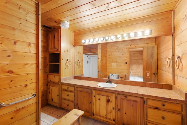 201 Cemetery Rd, Boyd, TX 76023 - bathroom with wooden ceiling, vanity, wood walls, and tile patterned floors