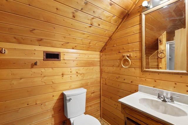 201 Cemetery Rd, Boyd, TX 76023 - bathroom featuring vaulted ceiling, vanity, and wood walls