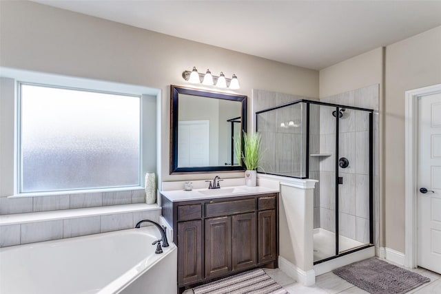 6829 Fire Dance Dr, Benbrook, TX 76126 - bathroom with a shower stall, a garden tub, vanity, and tile patterned flooring