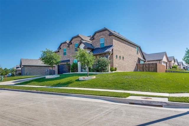 6829 Fire Dance Dr, Benbrook, TX 76126 - view of front of property featuring brick siding, a standing seam roof, and a residential view