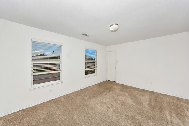 6021 Lucas Ct, Fort Worth, TX 76119 - spare room featuring carpet and baseboards