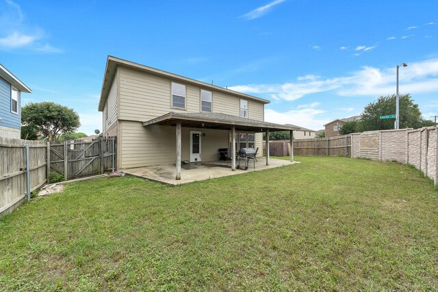 6021 Lucas Ct, Fort Worth, TX 76119 - back of house featuring a patio area and a gate