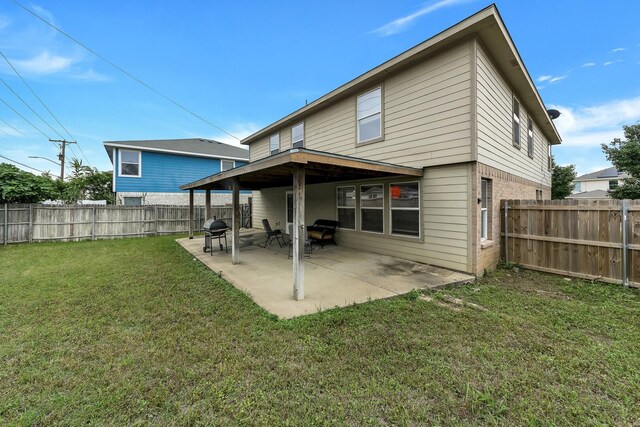 6021 Lucas Ct, Fort Worth, TX 76119 - rear view of house featuring a patio and brick siding
