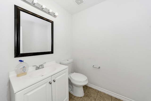 6021 Lucas Ct, Fort Worth, TX 76119 - bathroom with toilet, vanity, baseboards, and tile patterned flooring