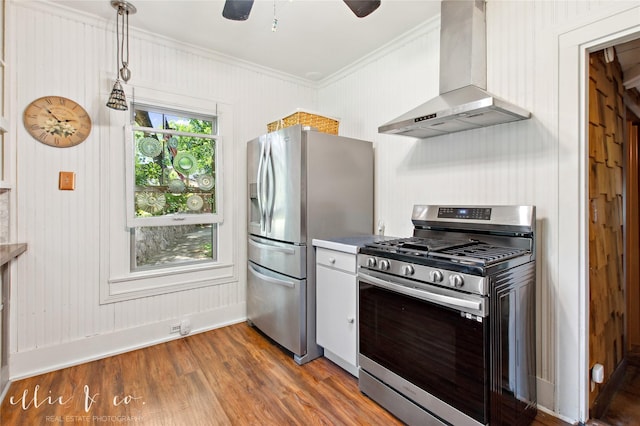 400 Riverside Blvd, Abilene, TX 79605 - kitchen with appliances with stainless steel finishes, wall chimney exhaust hood, ornamental molding, dark wood-style flooring, and baseboards