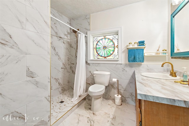 400 Riverside Blvd, Abilene, TX 79605 - bathroom with a stall shower, toilet, marble look tiles, and vanity