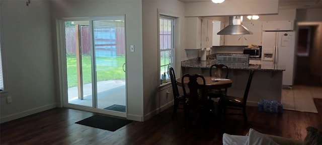 1302 Elby, Irving, TX 75061 - dining space featuring dark wood finished floors and baseboards