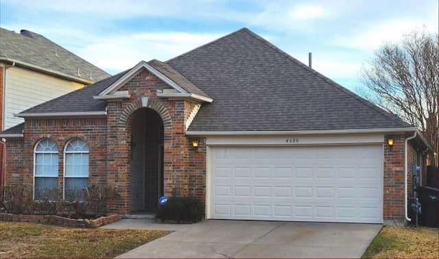 4600 Parkview Ln, Fort Worth, TX 76137 - traditional-style home with brick siding, driveway, a garage, and a shingled roof
