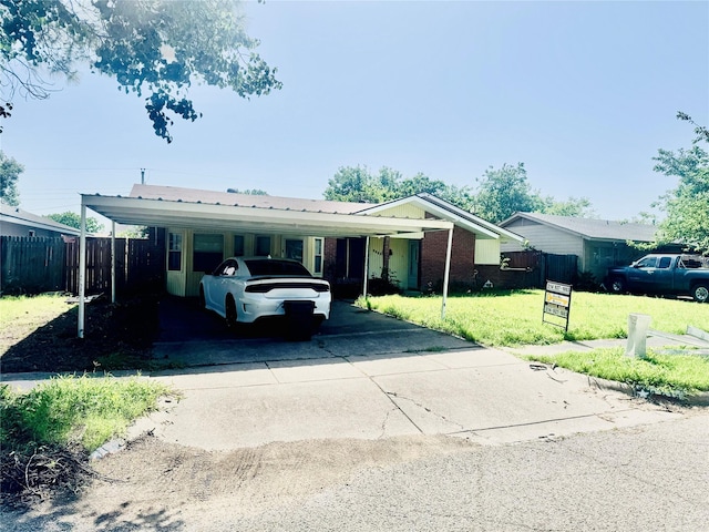 1614 Savage Dr, Mesquite, TX 75149 - ranch-style house featuring driveway, a carport, and brick siding