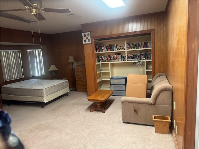 1614 Savage Dr, Mesquite, TX 75149 - carpeted bedroom with wooden walls and a ceiling fan