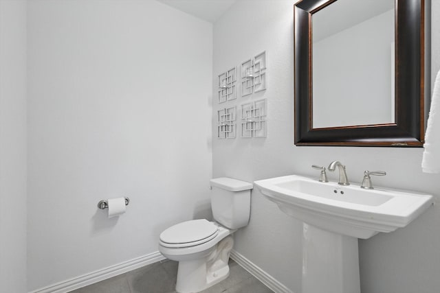 1000 Hazel Dr, Lantana, TX 76226 - bathroom with baseboards, toilet, tile patterned flooring, and a sink