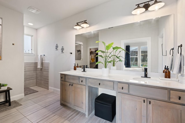 3925 Fairmount Ct, Sachse, TX 75048 - bathroom featuring baseboards, double vanity, and a shower