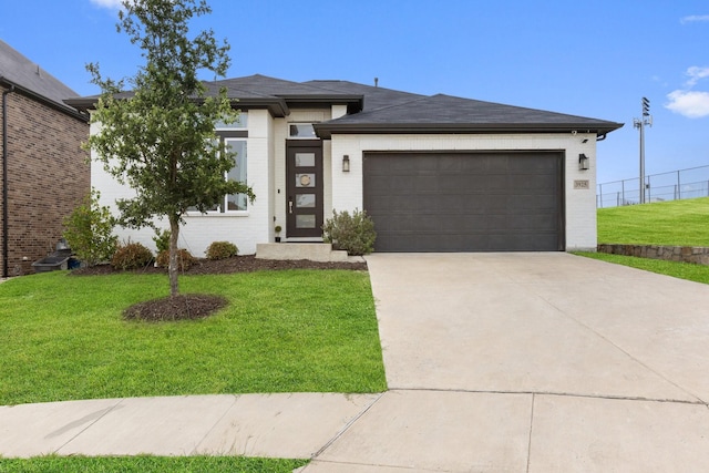 3925 Fairmount Ct, Sachse, TX 75048 - view of front facade with a front yard, a garage, and driveway