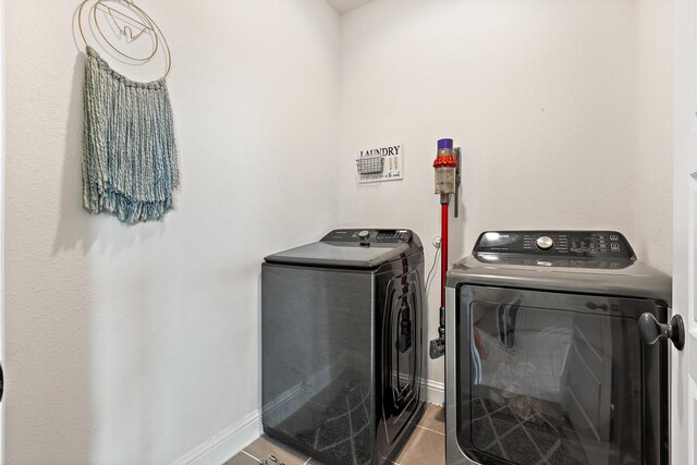 3925 Fairmount Ct, Sachse, TX 75048 - laundry room with independent washer and dryer, baseboards, and tile patterned flooring