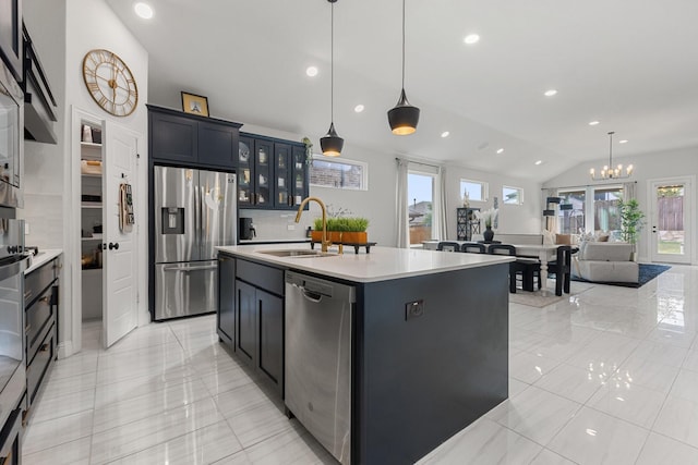 3925 Fairmount Ct, Sachse, TX 75048 - kitchen featuring stainless steel appliances, a sink, light countertops, lofted ceiling, and glass insert cabinets