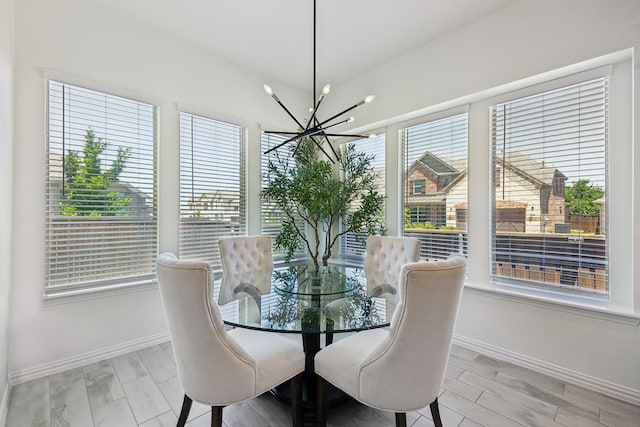 2004 Creekridge Dr, Lewisville, TX 75010 - dining space with a chandelier, healthy amount of natural light, and baseboards