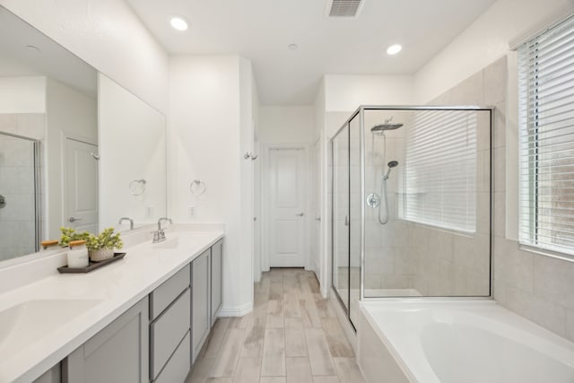 2004 Creekridge Dr, Lewisville, TX 75010 - full bathroom with a stall shower, a bath, double vanity, and recessed lighting