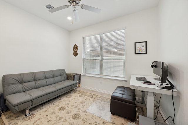 2004 Creekridge Dr, Lewisville, TX 75010 - living area with baseboards, a ceiling fan, and a desk