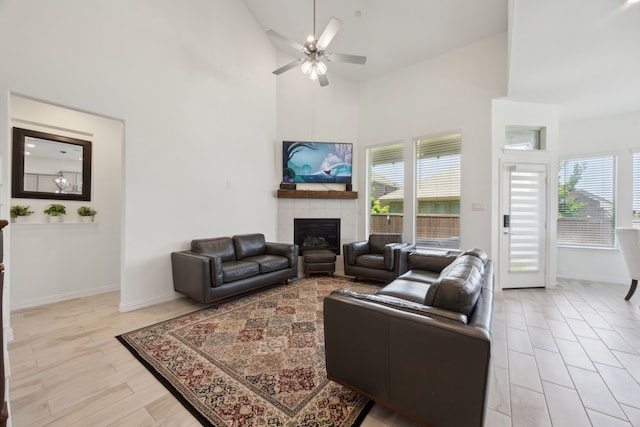2004 Creekridge Dr, Lewisville, TX 75010 - living area with a fireplace, high vaulted ceiling, ceiling fan, and baseboards
