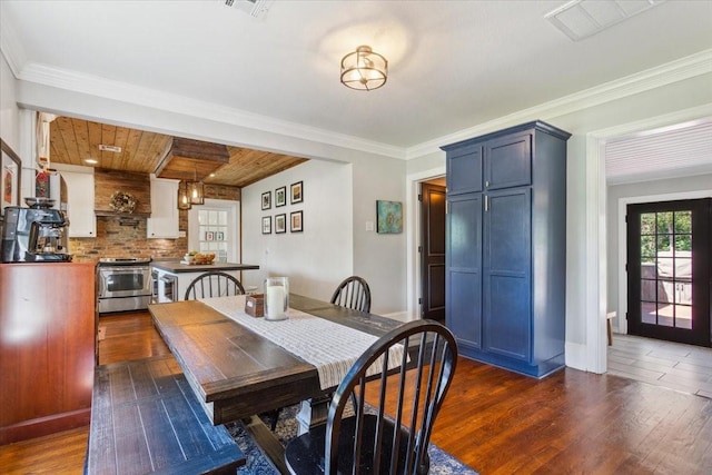 3227 Macarthur Dr, Waco, TX 76708 - dining room with dark wood finished floors and ornamental molding
