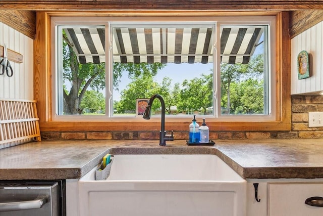 3227 Macarthur Dr, Waco, TX 76708 - kitchen featuring a sink, healthy amount of natural light, and white cabinets
