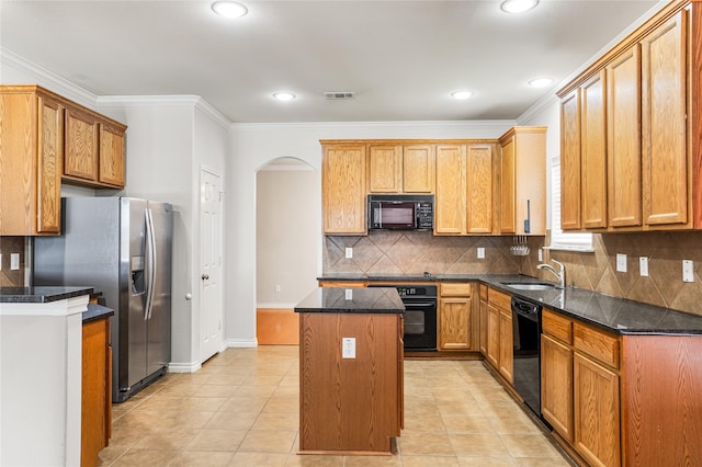 3737 Monica Ln, Fort Worth, TX 76244 - kitchen featuring black appliances, arched walkways, a kitchen island, a sink, and decorative backsplash