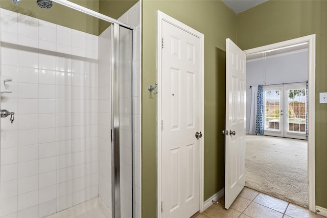 3737 Monica Ln, Fort Worth, TX 76244 - bathroom with a stall shower, french doors, tile patterned floors, and baseboards