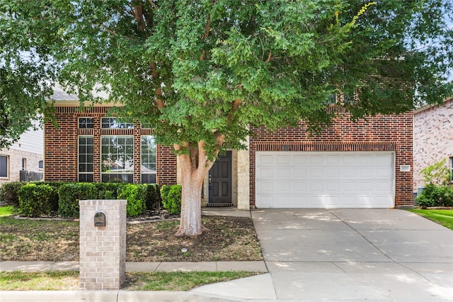 3737 Monica Ln, Fort Worth, TX 76244 - obstructed view of property with driveway, brick siding, and a garage