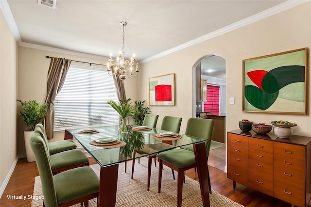 3737 Monica Ln, Fort Worth, TX 76244 - dining room featuring arched walkways, ornamental molding, a chandelier, dark wood-style floors, and baseboards