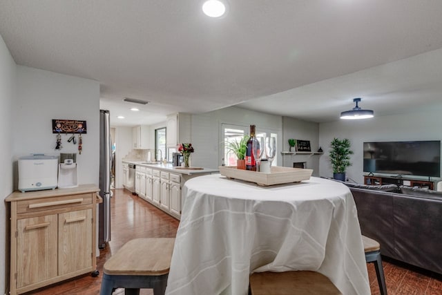 3510 Knoll Point Dr, Garland, TX 75043 - dining space featuring dark wood-style floors and recessed lighting