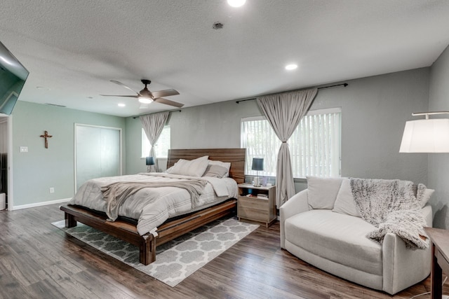 3510 Knoll Point Dr, Garland, TX 75043 - bedroom with ceiling fan, wood finished floors, recessed lighting, baseboards, and a textured ceiling