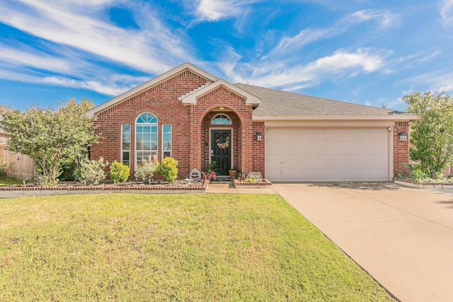 717 Kim Ln, Royse City, TX 75189 - view of front facade featuring brick siding, concrete driveway, a garage, and a front lawn