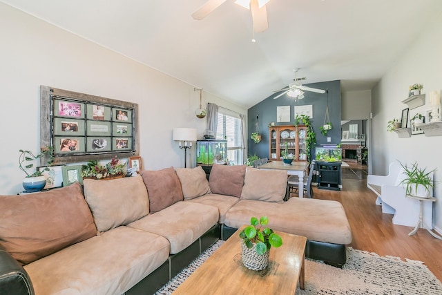 717 Kim Ln, Royse City, TX 75189 - living area featuring ceiling fan, wood finished floors, vaulted ceiling, and a fireplace