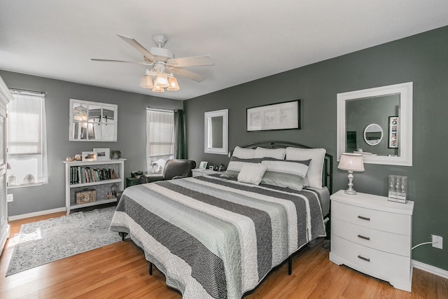 717 Kim Ln, Royse City, TX 75189 - bedroom with light wood-type flooring, baseboards, and ceiling fan