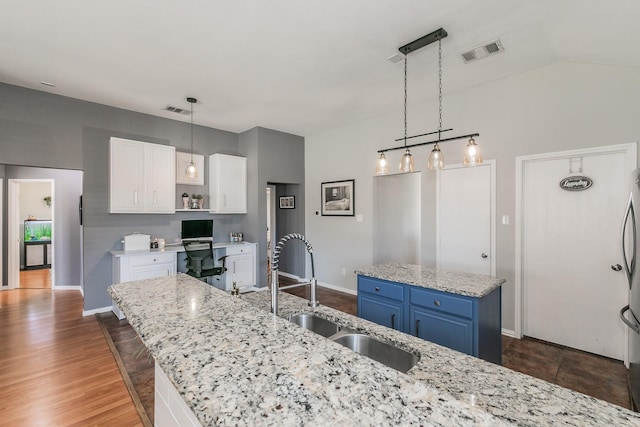 717 Kim Ln, Royse City, TX 75189 - kitchen with a sink, white cabinetry, open shelves, a kitchen island, and decorative light fixtures