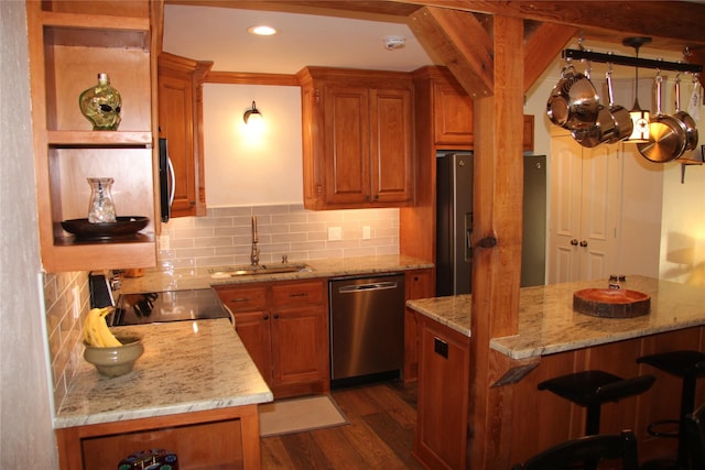 4320 Holland Ave Unit 202, Dallas, TX 75219 - kitchen with stainless steel dishwasher, brown cabinets, electric stove, dark wood-style floors, and a sink