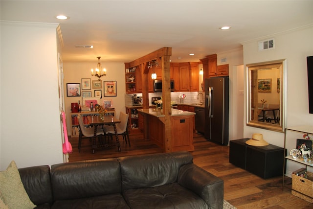 4320 Holland Ave Unit 202, Dallas, TX 75219 - living area featuring a chandelier, dark wood-style floors, crown molding, and recessed lighting