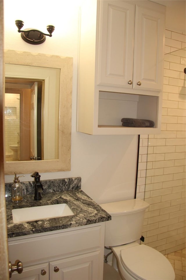 4320 Holland Ave Unit 202, Dallas, TX 75219 - bathroom featuring vanity and toilet