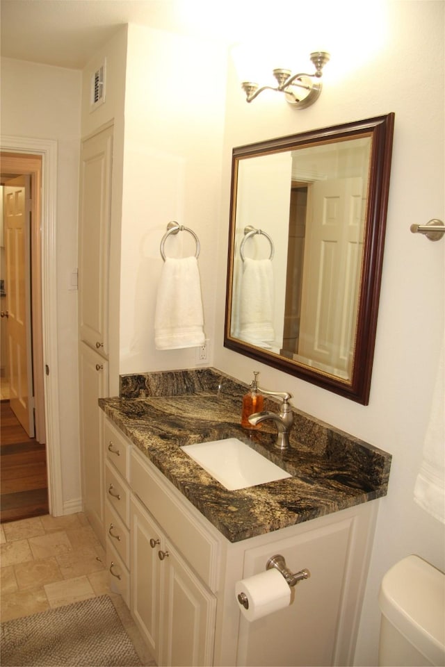 4320 Holland Ave Unit 202, Dallas, TX 75219 - half bathroom with vanity and toilet