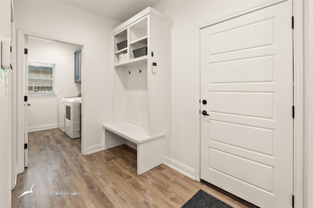 7010 Jet Stream Dr, Abilene, TX 79606 - mudroom featuring separate washer and dryer, light wood-style flooring, and baseboards